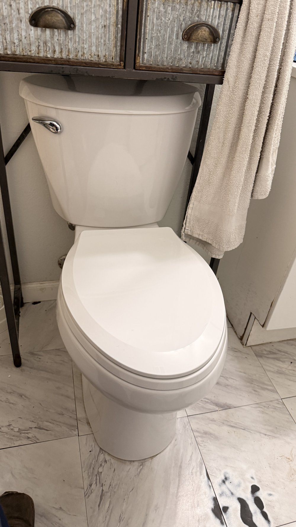 Newly installed toilet fixture in a bathroom