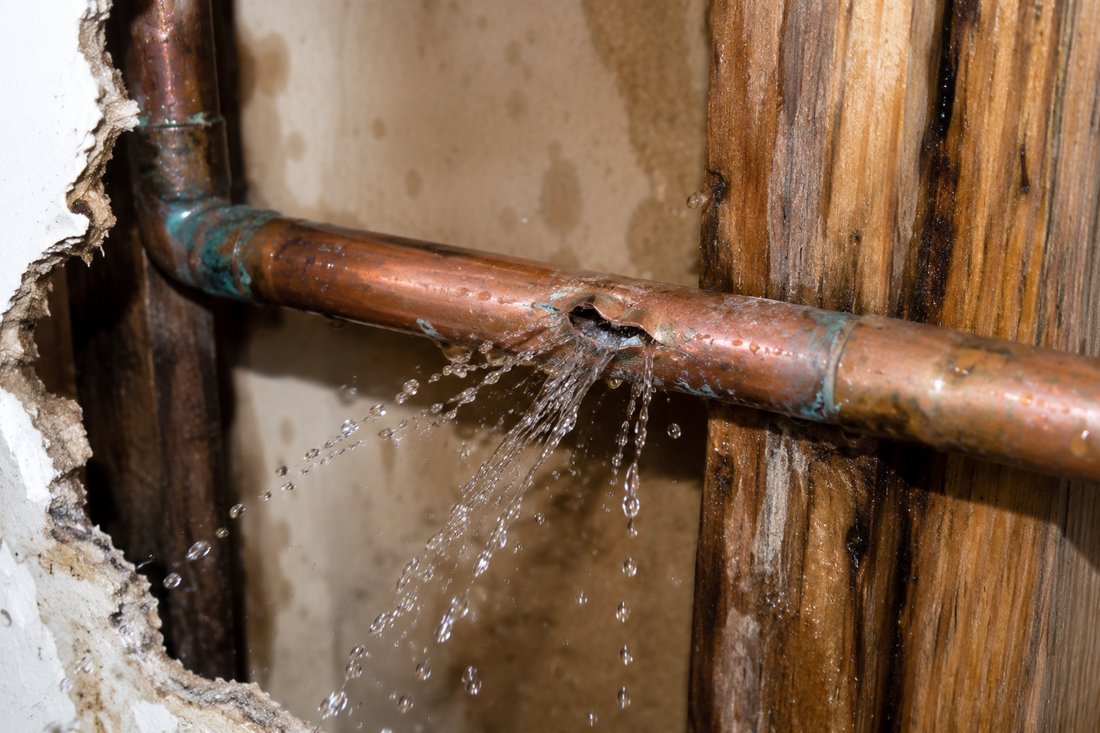 Leaking copper pipe before repair